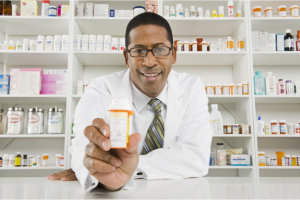 pharmacist showing a bottle of medicine